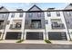 Stylish townhomes with modern facades, balconies, and attached garages at 8723 Nolley Ct, Charlotte, NC 28270