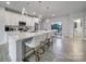 Kitchen featuring a center island, white cabinets, stainless steel appliances, and barstool seating at 8723 Nolley Ct, Charlotte, NC 28270