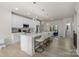 Bright kitchen featuring a large island with seating, stainless steel appliances and modern pendant lighting at 8723 Nolley Ct, Charlotte, NC 28270