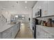 Bright, open-concept kitchen features a large island and modern appliances with seamless access to the living space at 8723 Nolley Ct, Charlotte, NC 28270