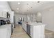 Modern kitchen features a central island, stainless steel appliances, and an open-concept design for entertaining at 8723 Nolley Ct, Charlotte, NC 28270