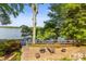 Scenic backyard with a brick patio, a fire pit, and beautiful views of the lake at 9289 Azalea Rd, Sherrills Ford, NC 28673