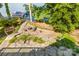 Landscaped backyard with stone patio, fire pit, and charming garden areas, ideal for entertaining at 9289 Azalea Rd, Sherrills Ford, NC 28673