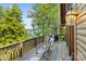 Spacious deck with wood railing overlooking the lake, perfect for outdoor entertaining and enjoying scenic views at 9289 Azalea Rd, Sherrills Ford, NC 28673