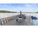 Dock with seating overlooking tranquil lake, perfect for relaxing and entertaining guests at 9289 Azalea Rd, Sherrills Ford, NC 28673