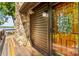 Charming entrance featuring a stone wall, rustic wood door, and unique stained glass window detail at 9289 Azalea Rd, Sherrills Ford, NC 28673