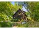 Wood-sided home surrounded by lush greenery and landscaping at 9289 Azalea Rd, Sherrills Ford, NC 28673