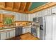 Well-maintained kitchen with stainless steel appliances, light countertops, and gold trimmed white cabinetry at 9289 Azalea Rd, Sherrills Ford, NC 28673