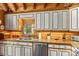 Well-maintained kitchen with light countertops, wood trimmed white cabinetry, and stainless steel appliances at 9289 Azalea Rd, Sherrills Ford, NC 28673