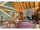 Inviting living room featuring a stone fireplace, rustic wood accents, and an open floor plan at 9289 Azalea Rd, Sherrills Ford, NC 28673