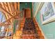 Elegant staircase with a wooden banister and a decorative rug runner at 9289 Azalea Rd, Sherrills Ford, NC 28673