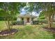Attractive home with a manicured front yard, flowering bushes, and mature trees at 1000 Oakshade Ave, Kannapolis, NC 28083