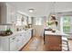 Inviting kitchen featuring white cabinets, modern appliances, and a functional island at 1000 Oakshade Ave, Kannapolis, NC 28083