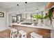 Modern kitchen featuring a large island, pendant lighting, and stainless-steel appliances at 1000 Oakshade Ave, Kannapolis, NC 28083