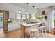 Bright kitchen featuring white cabinets, stainless appliances, and a stylish center island with seating at 1000 Oakshade Ave, Kannapolis, NC 28083