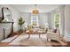 Cozy living room featuring a decorative fireplace, stylish decor, and bright, neutral colors at 1000 Oakshade Ave, Kannapolis, NC 28083
