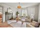 Bright living room with a decorative fireplace, stylish decor, and a tan sofa at 1000 Oakshade Ave, Kannapolis, NC 28083