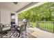 Relaxing covered back porch with seating and view of private backyard at 1140 Landsdown Dr, Salisbury, NC 28147