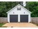 Detached two-car garage with modern doors and exterior lighting at 1140 Landsdown Dr, Salisbury, NC 28147