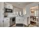 Contemporary kitchen featuring stainless steel appliances and sleek, white cabinets at 1140 Landsdown Dr, Salisbury, NC 28147