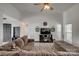 Bright living room featuring a large sectional sofa, ceiling fan and stylish console at 1140 Landsdown Dr, Salisbury, NC 28147
