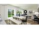 Open concept living and dining area with hardwood floors, white walls, and ample natural light at 118 Parker Claire Ln, Kings Mountain, NC 28086