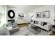 Bright living room with hardwood floors, a fireplace, neutral-toned furniture, and modern decor at 118 Parker Claire Ln, Kings Mountain, NC 28086