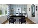 Home office with a large window, dark wood desk, stylish decor, hardwood floors, and modern lighting at 118 Parker Claire Ln, Kings Mountain, NC 28086