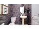 Chic powder room with modern fixtures, stylish wallpaper, and a pedestal sink at 118 Parker Claire Ln, Kings Mountain, NC 28086