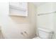 Clean half bathroom offering a vanity cabinet and a storage cabinet above the toilet at 1215 Green Oaks Ln # H, Charlotte, NC 28205