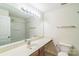Bathroom with a long vanity, large mirror, and shower-tub combo at 1215 Green Oaks Ln # H, Charlotte, NC 28205