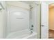 A bright white bathroom with a tub and shower combination at 1215 Green Oaks Ln # H, Charlotte, NC 28205
