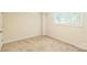 A carpeted bedroom has a large window bringing natural light into the space at 1215 Green Oaks Ln # H, Charlotte, NC 28205