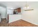 Bright dining area showcases wood flooring and a lovely light fixture, creating a welcoming atmosphere at 1215 Green Oaks Ln # H, Charlotte, NC 28205