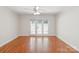 Spacious living room with hardwood floors, ceiling fan, and natural light, ideal for relaxation at 1215 Green Oaks Ln # H, Charlotte, NC 28205