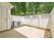 This patio is enclosed with a white privacy fence and offers an outdoor living space at 1215 Green Oaks Ln # H, Charlotte, NC 28205