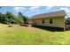 Large backyard with a deck and stone fire pit for outdoor enjoyment at 1221 Woodpecker Dr, Clover, SC 29710