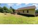 Well-manicured backyard featuring a wooden deck, lush lawn, mature trees, and a peaceful setting for outdoor enjoyment at 1221 Woodpecker Dr, Clover, SC 29710