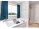 Bright bathroom with a large garden tub and a separate shower at 1221 Woodpecker Dr, Clover, SC 29710