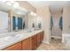 Bathroom boasts a double sink vanity and a large mirror for comfort and convenience at 1221 Woodpecker Dr, Clover, SC 29710