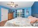 Sun-filled bedroom with hardwood floors, a ceiling fan, and a bright window at 1221 Woodpecker Dr, Clover, SC 29710
