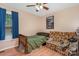 Cozy bedroom with a comfortable bed, a ceiling fan and a bright window at 1221 Woodpecker Dr, Clover, SC 29710