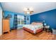 Large primary bedroom with a ceiling fan, hardwood floors, and a window view at 1221 Woodpecker Dr, Clover, SC 29710