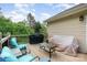 The outdoor deck has plenty of space for entertaining and features modern outdoor furniture at 1221 Woodpecker Dr, Clover, SC 29710