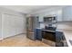 The kitchen has stainless steel appliances, light blue cabinets, and lots of storage space at 1221 Woodpecker Dr, Clover, SC 29710