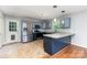 Well-equipped kitchen with stainless steel appliances, gray cabinets, and a functional breakfast bar at 1221 Woodpecker Dr, Clover, SC 29710