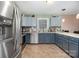 This spacious kitchen features stainless steel appliances and tile flooring at 1221 Woodpecker Dr, Clover, SC 29710