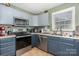 Charming kitchen featuring stainless steel appliances, tile flooring and a window for natural light at 1221 Woodpecker Dr, Clover, SC 29710