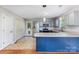Modern kitchen featuring stainless steel appliances, gray cabinetry, and a convenient breakfast bar area at 1221 Woodpecker Dr, Clover, SC 29710