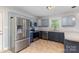 Updated kitchen with stainless steel appliances, gray cabinets, and a spacious layout for cooking at 1221 Woodpecker Dr, Clover, SC 29710